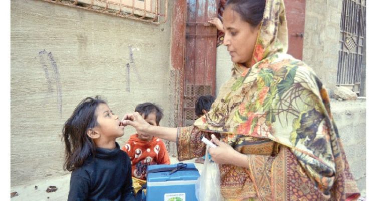 a lady health worker administers polio vaccine to a child in a karachi neighbourhood on monday photo jalal qureshi express